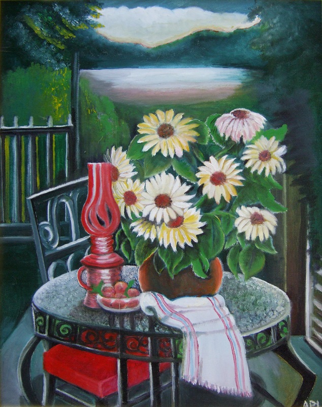 The painting is of a patio with a wrought iron table and chair. On the table is red kerocene lamp and a bouguet of sunflowers, beyond are trees and an evening sky